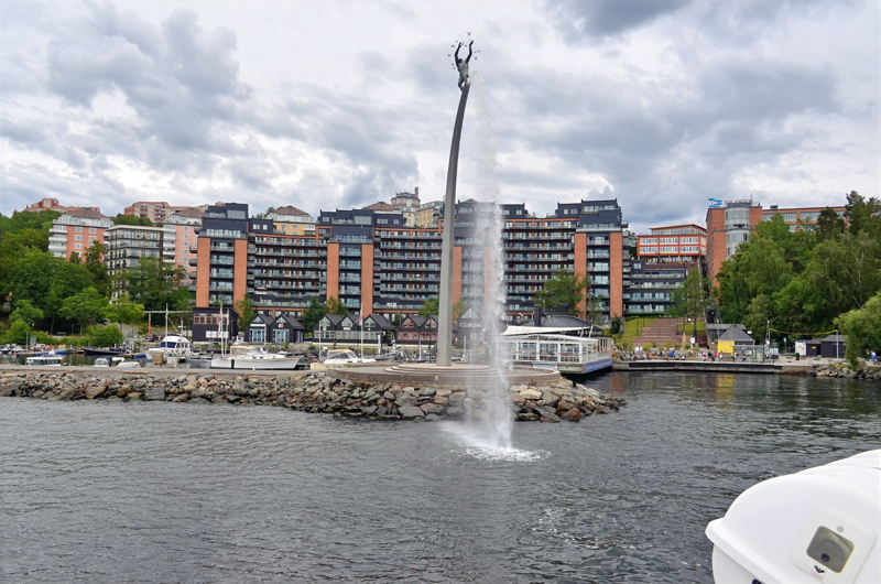 27 - The Nacka Strand in Stockholm, Sweden, featuring a prominent waterfront sculpture and residential buildings